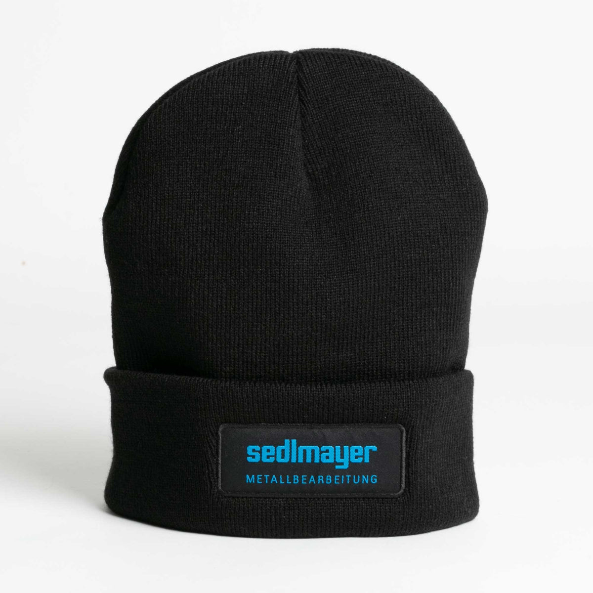 Strickmütze Schwarz (SEDLMAYER) – mit Logo besticken